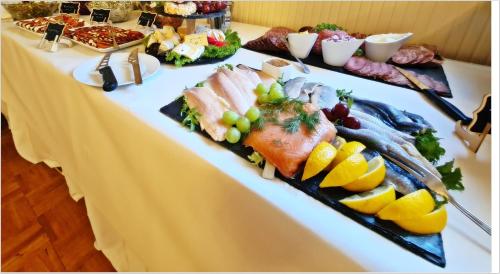 a table with several different types of food on it at DM Hotels & Apartments - Hotel Deutsches Haus in Dingelstädt