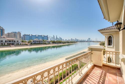 a view of a river from a balcony at SOL Living - Exquisite 5BR Garden Villa w/Pool & Beach in Palm in Dubai