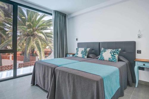 Postel nebo postele na pokoji v ubytování Two Dreams Luxury Villa