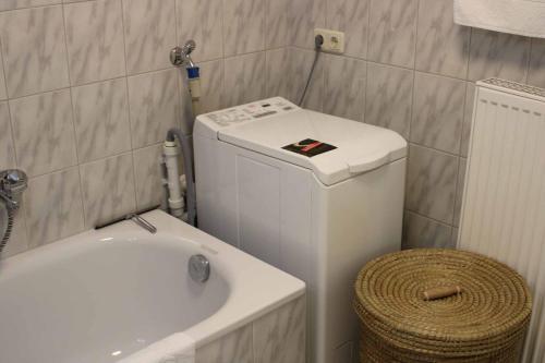a small bathroom with a toilet and a sink at Ferienwohnung Veronika in Bad Griesbach