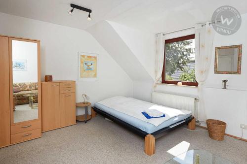 Katil atau katil-katil dalam bilik di Ferienwohnung-Osten