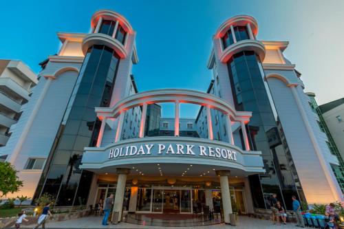 a building with a sign that reads holiday park resort at Holiday Park Resort in Okurcalar