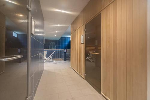 a hallway with wooden walls and a hallway with a hallway at Villages Clubs du Soleil - MARSEILLE in Marseille