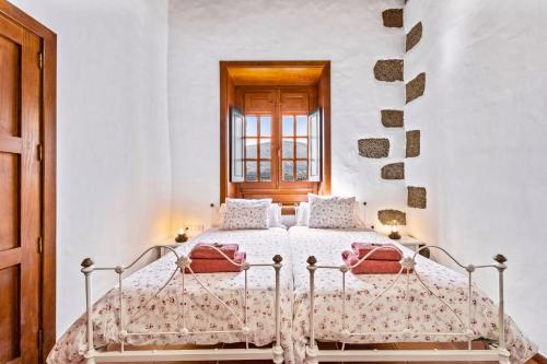 Postel nebo postele na pokoji v ubytování Petit La Geria Lanzarote