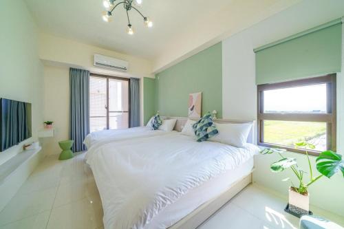 a bedroom with two beds and a window at Rice mansion in Wujie