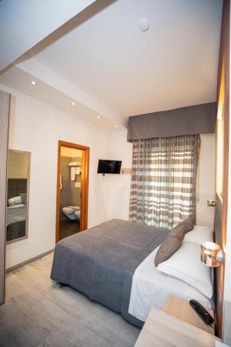 Cama o camas de una habitación en Hotel Gabbiano