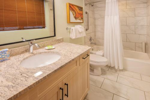a bathroom with a sink and a toilet and a shower at WorldMark Santa Fe in Santa Fe