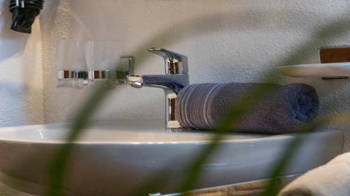 a bathroom with a sink with a towel on it at Pension Riese in Neustift im Stubaital