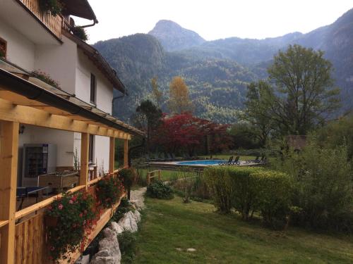 a house with a view of the mountains at Seehotel am Hallstättersee modern rooms in Obertraun
