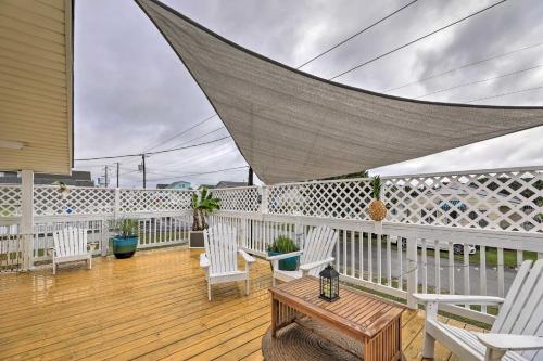 a porch with white chairs and a table on a deck at Pet-Friendly Townhome, 2 Blocks to Atlantic Beach! in Atlantic Beach