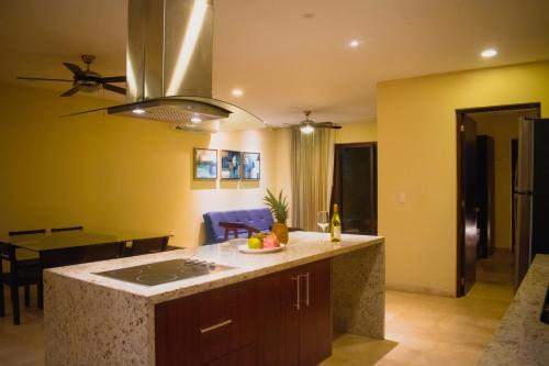a kitchen with a sink and a counter top at Villas Grand Marina Kinuh in Telchac Puerto