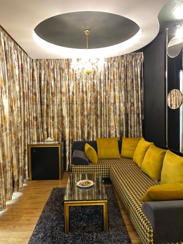 a living room with a couch and a table at New W Hotel in Tirana