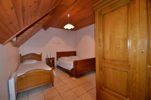 Ένα ή περισσότερα κρεβάτια σε δωμάτιο στο Apartments Gite le Picors