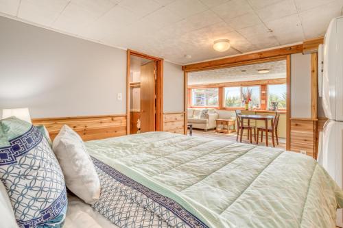 a bedroom with a bed and a dining room at Sea Haven in Lincoln City