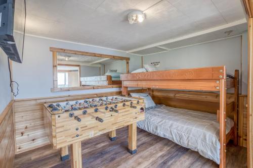 a bedroom with a bed and a foosball board at Sea Haven in Lincoln City