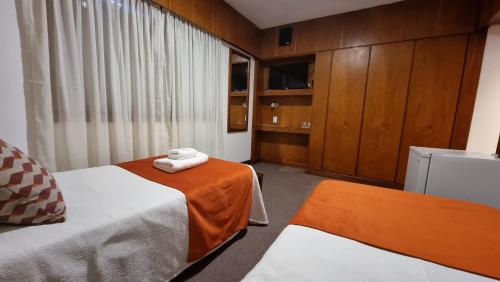 Vuode tai vuoteita majoituspaikassa Hotel Ikera