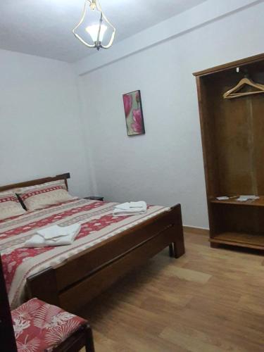 a bedroom with a bed and a dresser at ANTICA NEVIERA HOUSE in Castel di Sangro