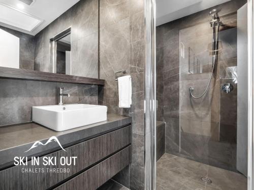 a bathroom with a sink and a shower at Ski In Ski Out #08 in Thredbo