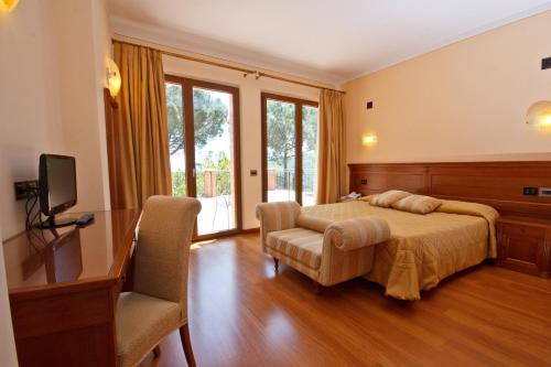 Säng eller sängar i ett rum på Hotel Panoramic Montepulciano
