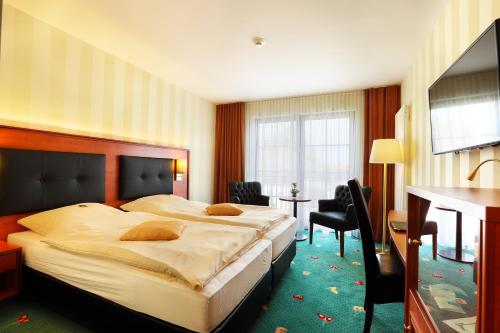 Postel nebo postele na pokoji v ubytování Hotel Freihof