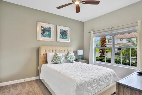 a bedroom with a bed and a ceiling fan at Modern Luxury at Champions Gate Resort in Davenport