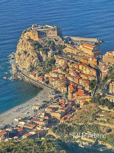 a village on a hill with the ocean at ATHENA in Scilla