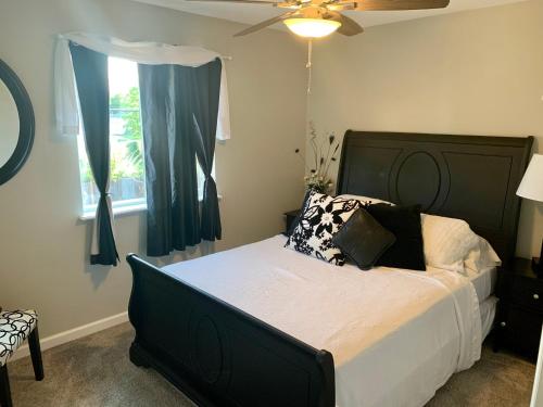 a bedroom with a bed and a ceiling fan at Your home close to Anshutz and DIA in Aurora