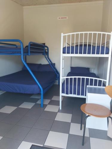 a room with two bunk beds and a table at Charleston Holiday Park in Charleston