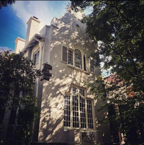 a white building with windows on the side of it at The Great Gatsby Houghton in Johannesburg