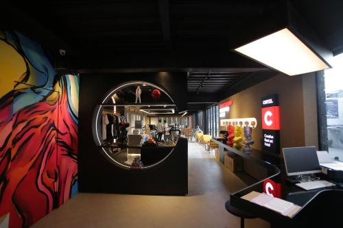 a store with a mirror on the wall at Creative Restart Hotel - CARTEL Bandung in Bandung