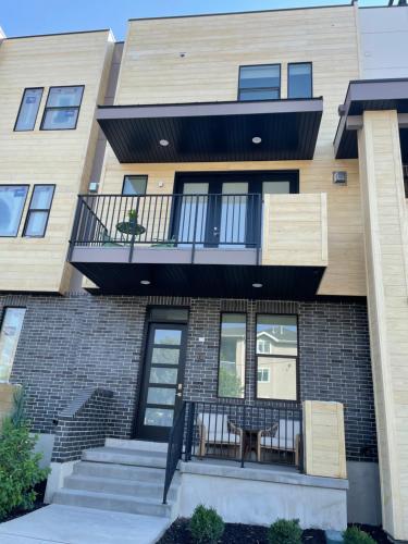 a house with a balcony and stairs in front of it at 110 Downtown in Provo