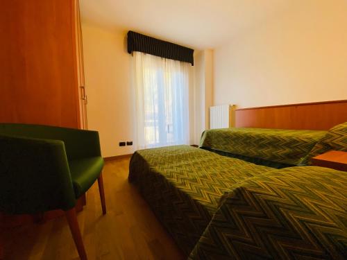 Ein Bett oder Betten in einem Zimmer der Unterkunft Residence Pizzo Scalino