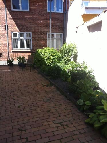Ein Garten an der Unterkunft Det Lille Hotel