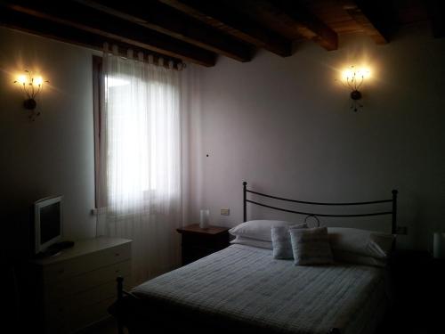 Cama o camas de una habitación en BB Parco del Mincio