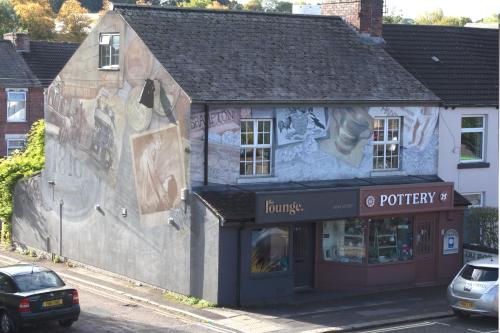a building with graffiti on the side of it at The Pottery Flat Chesterfield Three Star Gold in Chesterfield
