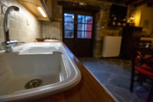a kitchen sink with a faucet on top of it at Villa Georgia in Vitsa