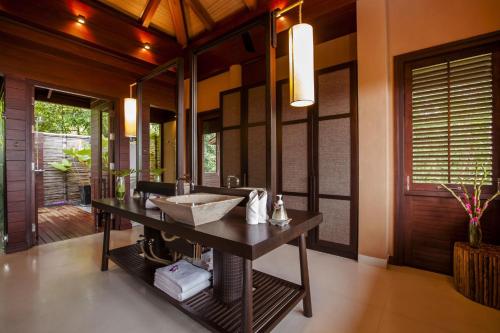 a bathroom with a sink and a mirror at Villa Lydia, Koh Yao Noi in Ko Yao Noi