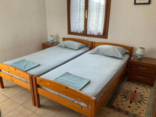 Un pat sau paturi într-o cameră la Villa Christina