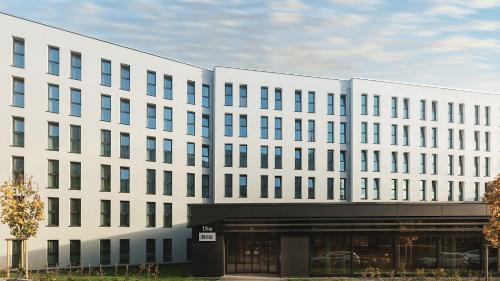 a large white building with a lot of windows at Holiday Inn - the niu, Kettle Stuttgart Vaihingen by IHG in Stuttgart