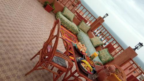 an overhead view of a table with a bench at Brothers House 1 in Imsouane
