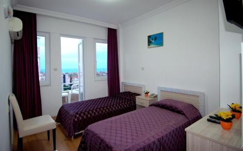 Postel nebo postele na pokoji v ubytování Lara Diamond Hotel