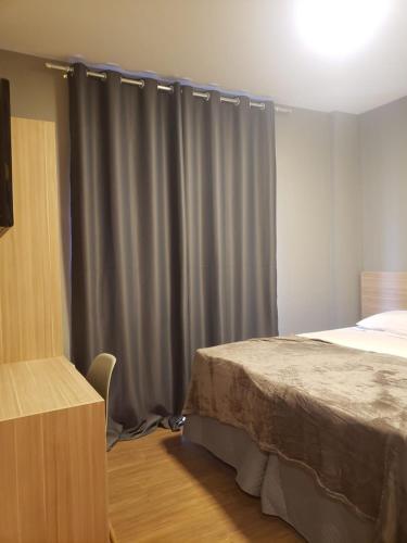 Säng eller sängar i ett rum på Unity Hotel - Vila Mariana SP