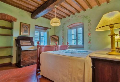 Ένα ή περισσότερα κρεβάτια σε δωμάτιο στο Agriturismo I Frati