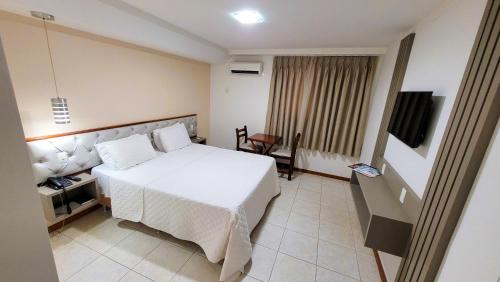 Postel nebo postele na pokoji v ubytování Rios Hotel