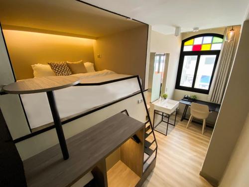 a small room with a bed and a dining room at ST Signature Jalan Besar, DAYUSE, 5 Hours, 5PM-10PM in Singapore
