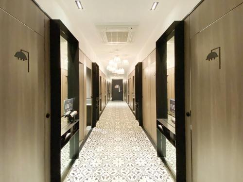 a corridor of a hallway with a tile floor at ST Signature Jalan Besar, DAYUSE, 5 Hours, 5PM-10PM in Singapore