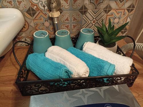 a basket with towels and candles on a table at Apartment Close2park *** in Čakovec