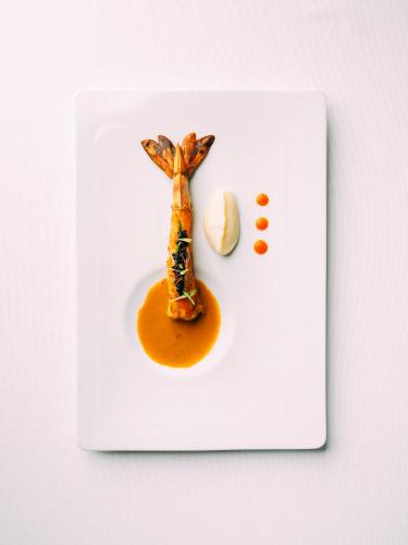 a plate of food with a dinosaur on it at Montebelo Vista Alegre Ílhavo Hotel in Ílhavo