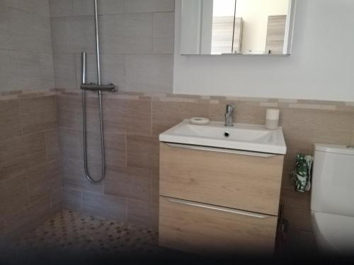 a bathroom with a sink and a shower at Beautiful 2-Bed House in Saint-Leger-Magnazeix in Saint-Léger-Magnazeix