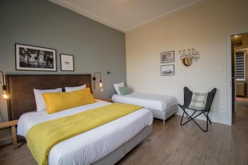 Ένα ή περισσότερα κρεβάτια σε δωμάτιο στο Hello Colmar, Duplex Cathedrale, historic center